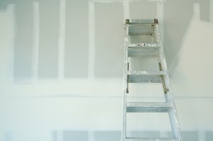 New Sheetrock Drywall Abstract Background in New Home Construction Site with Ladder